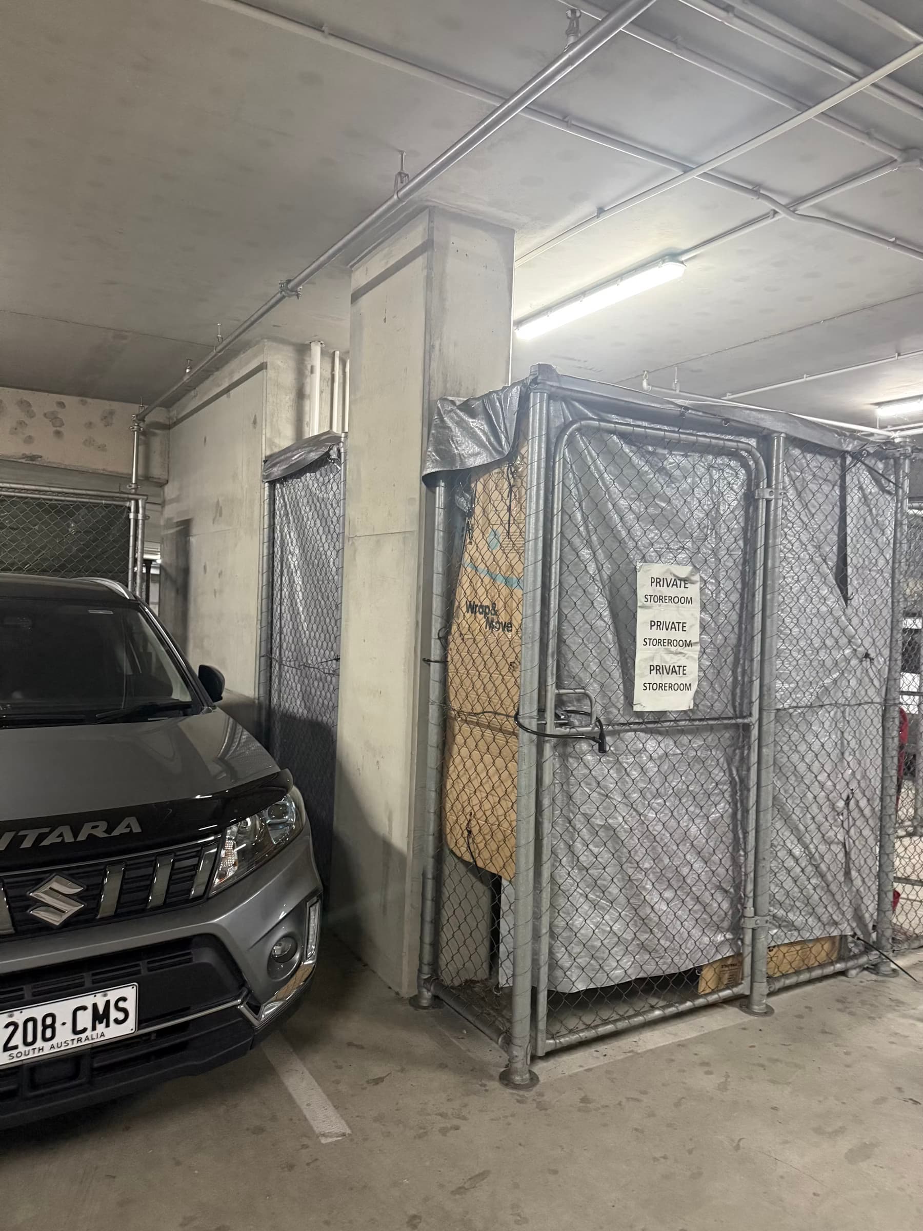 Storage pen in apartment car park space